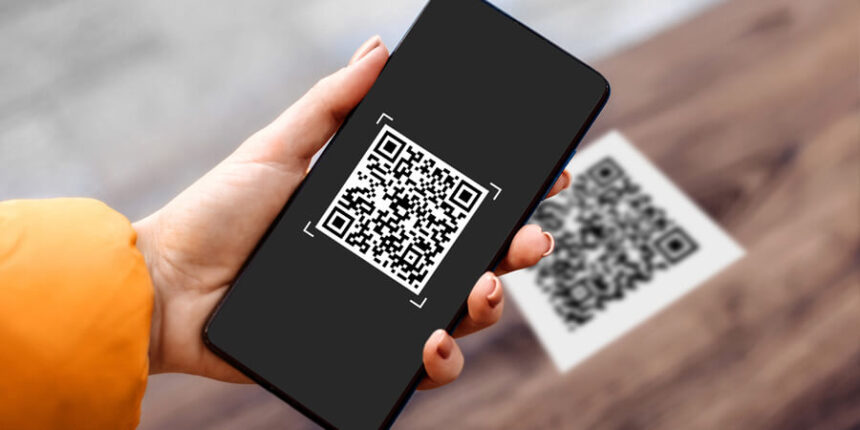 Customer using cryptocurrency payment via QR code at South African retail store